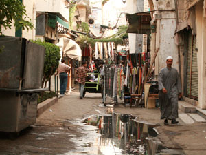 A street scene in Egypt; The artist Susan Paszkiewicz-Toler with printmakers in the Egyptian print making studio